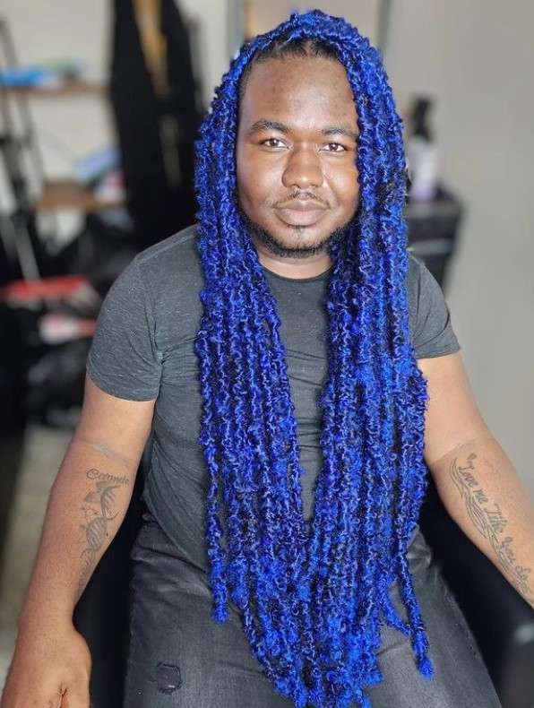 A person with blue boho locs