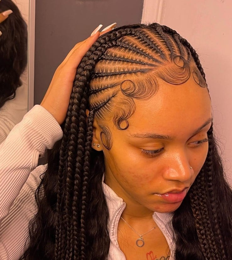 A lady with braids with weave hairstyle